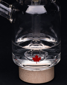Handblown glass bubbler water pipe with 9-slit showerhead percolator in use